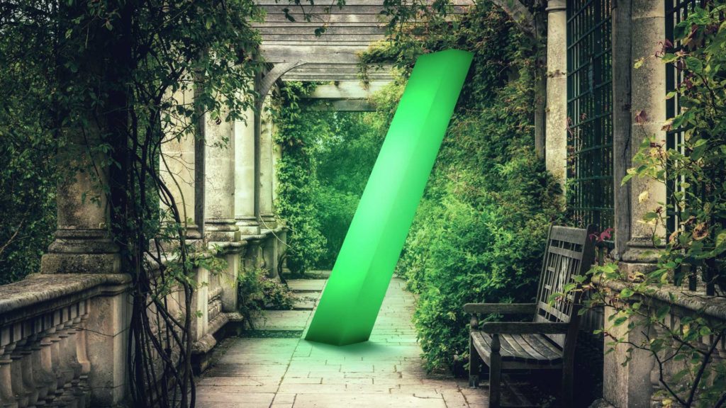 An established garden walkway with a big green glowing 3D forward slash in it